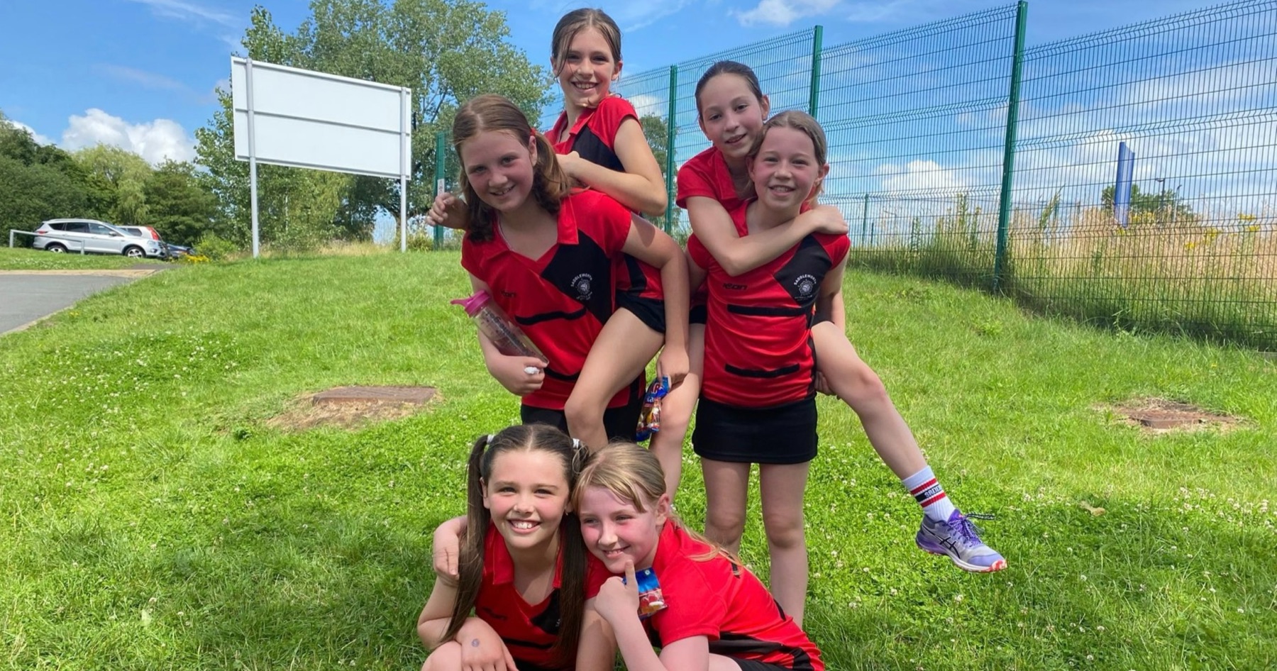 Saddleworth players together on the grass after a tournament