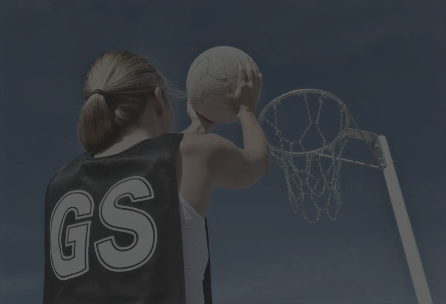 A goal shooter lining up a shot at the net